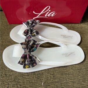 Never worn Lia’s! White with Flowers’s run narrow